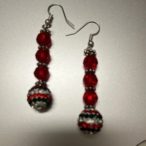 Red and silver earrings.crystal balls hanging on the earring.